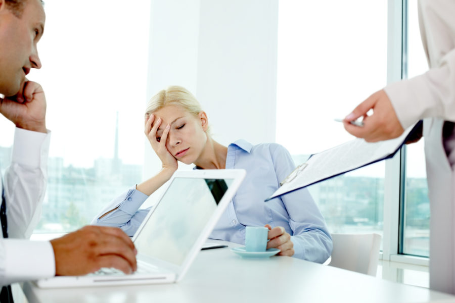 Blond Woman Falling Asleep In A Work Meeting