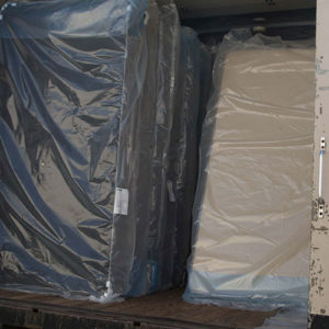 Mattresses And Box Springs In Back Of Delivery Truck