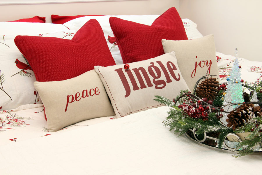 Sleep Gift Guide - Holiday Themed Pillows On Bed